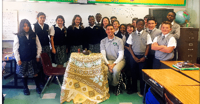 classroom posing with the peace table